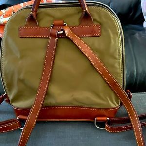 Dooney & Bourke backpack. Olive green/gold nylon with leather straps.
